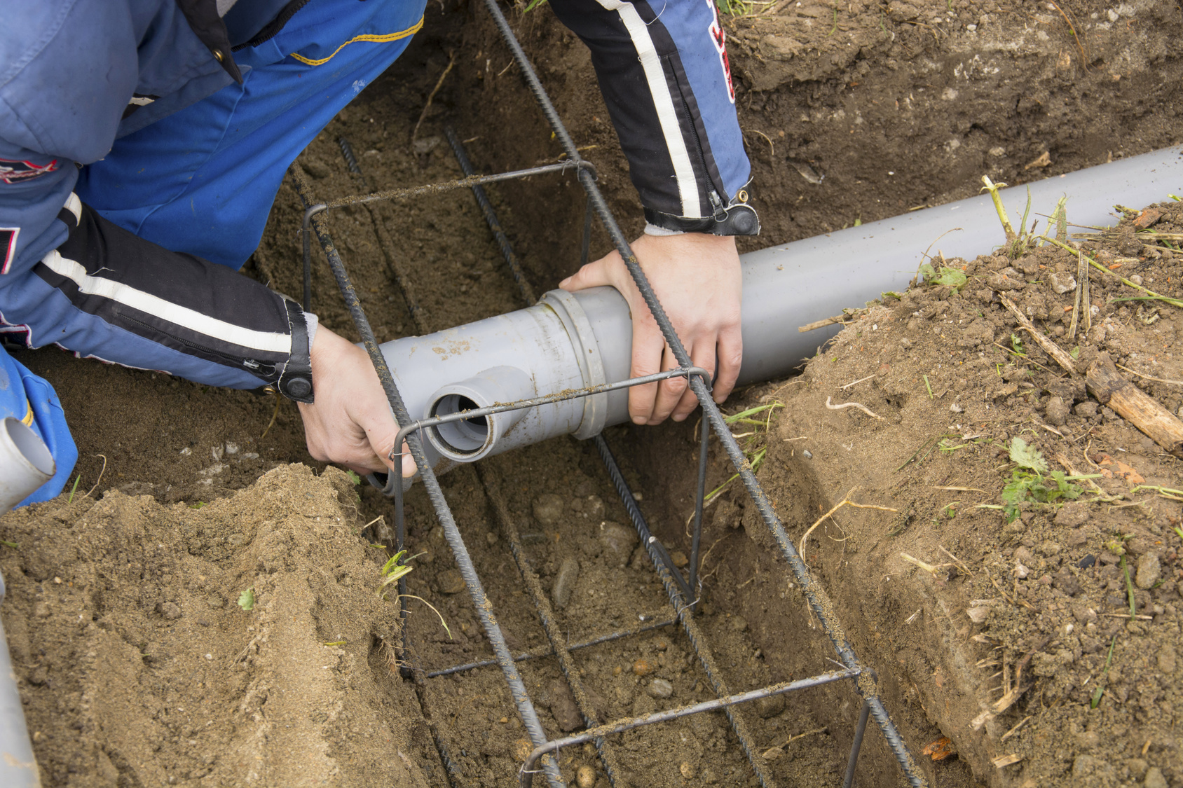 worker connecting pipes